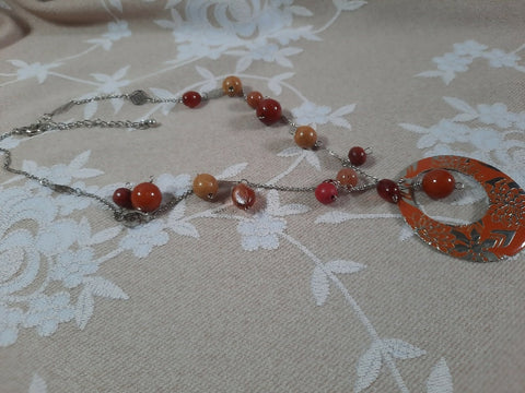 Orange floral pendant with warm-tone beads on chain Necklace