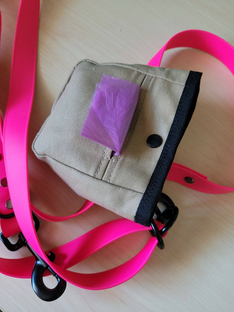 Dog treat pouch and waste bag holder.