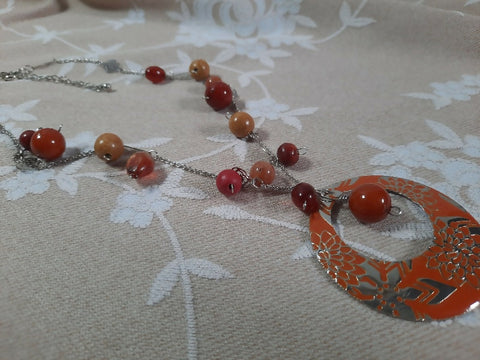 Orange floral pendant with warm-tone beads on chain Necklace