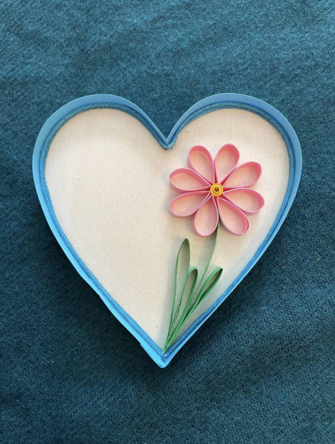 Paper quilled daisy in a heart