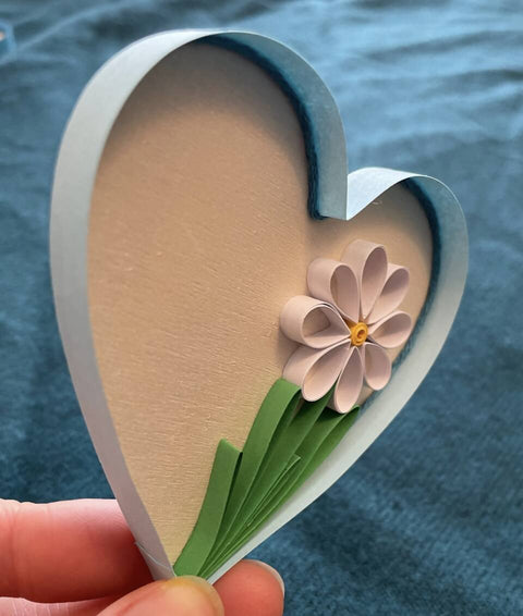 Paper quilled daisy in a heart